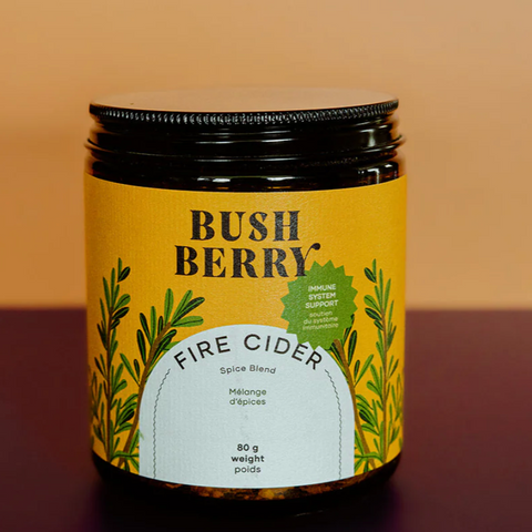 Jar of Bush Berry Fire Cider on a gradient background