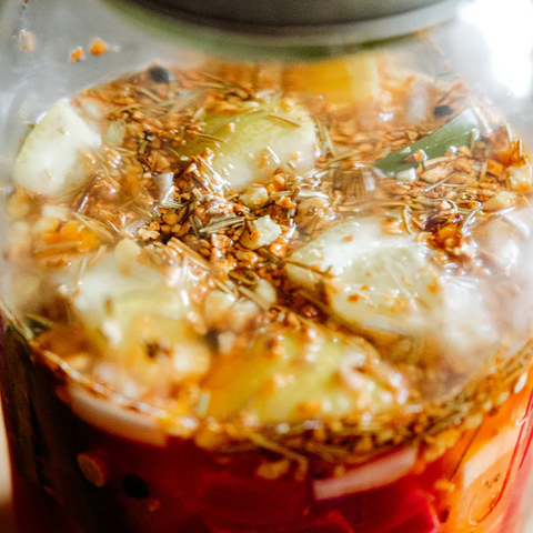Jar of pickled vegetables with a label on the right side.