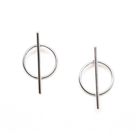Pair of silver earrings with circular and vertical bar designs on a white background