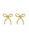 Gold bow-shaped earrings on a white background