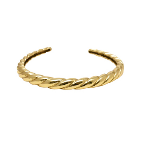 Gold braided bracelet on a white background