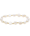 Pearl bracelet with gold accents on a white background