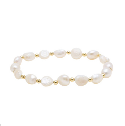 Pearl bracelet with gold accents on a white background
