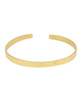 Gold bangle on a white background
