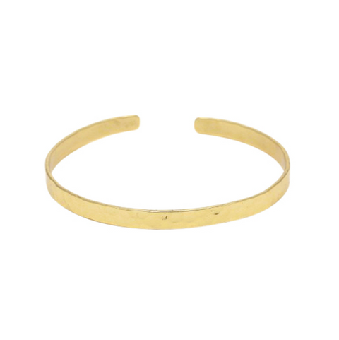Gold bangle on a white background
