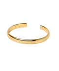 Gold bangle on a white background