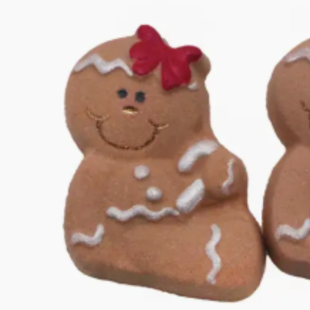Two gingerbread cookie-shaped figurines with decorative elements on a white background