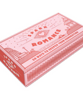 Pink book box with 'Spark Romance' branding on a white background