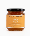 Jar of Provisions Food Company Peach Apricot spread on a white background