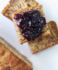 Toast with jelly on a white plate, with a computer screen interface at the bottom.