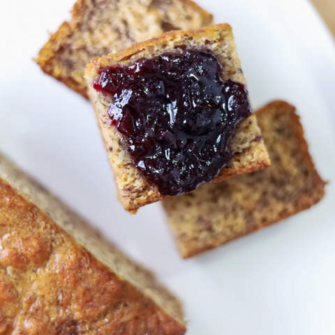Toast with jelly on a white plate, with a computer screen interface at the bottom.