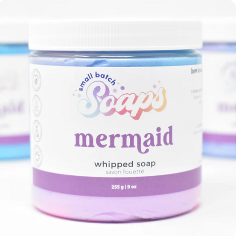 Jar of 'mermaid' whipped soap with colorful label on a white background