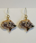 Pair of earrings with floral designs on a white background