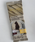 Packaged chocolate bar with branding on a light gray background