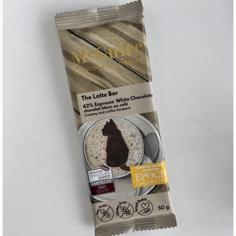Packaged chocolate bar with branding on a light gray background