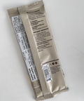 Two beige packets with text and a barcode on a white background