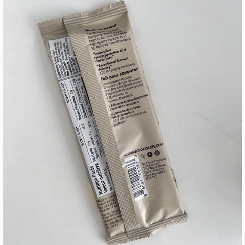 Two beige packets with text and a barcode on a white background