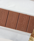 Chocolate bar with 'MacGuire's' branding on a white surface