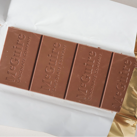 Chocolate bar with 'MacGuire's' branding on a white surface