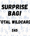 Promotional graphic for a 'Surprise Bag! Total Wildcard' with a price of $45 on a floral background.