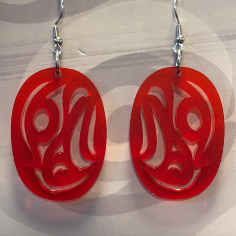 Red earrings with a unique design on a neutral background