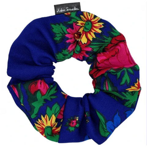 Colorful floral scrunchie with a blue base on a white background