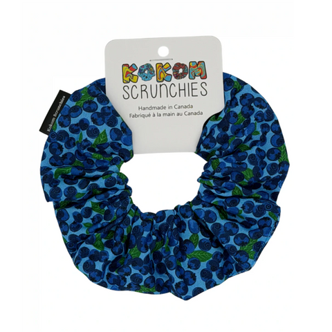 Blue scrunchie with green pattern on a white background, featuring a 'Kokom Scrunchies' label.