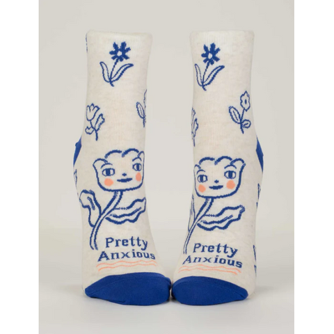 Pair of socks with blue flowers and 'Pretty Anxious' text on a white background