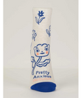 White sock with blue floral design and text on a website page