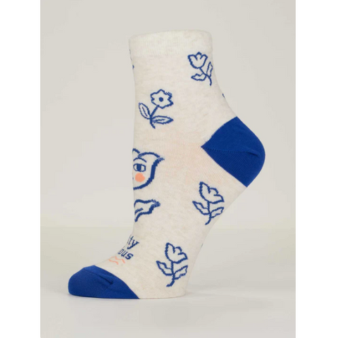 White sock with blue accents and floral designs on a gray background