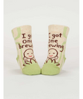 Baby socks with text and illustrations on a product page