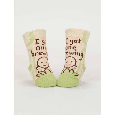 Baby socks with text and illustrations on a product page