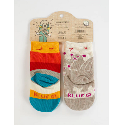 Pair of colorful socks on a packaging with 'Blue Q' branding on a website page.