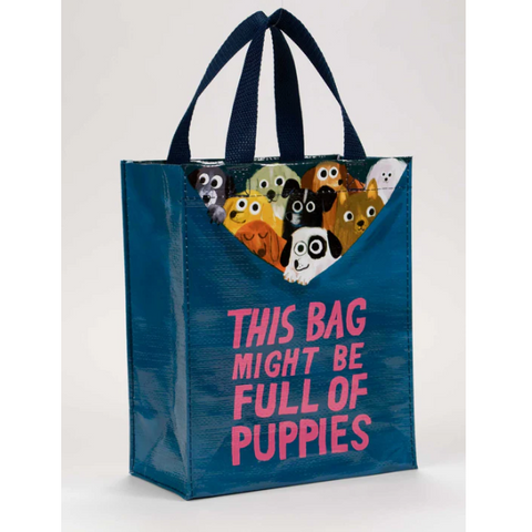 Blue tote bag with cartoon puppies and text 'This Bag Might Be Full of Puppies' on a white background