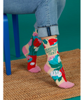 Colorful socks with floral patterns and text on a product page.