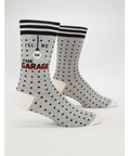 Gray socks with black polka dots and text on a white background