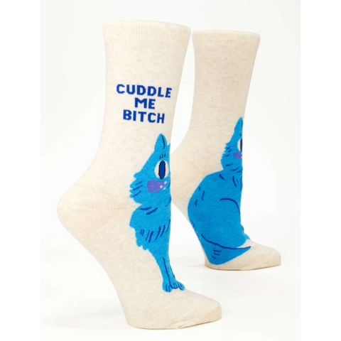 Pair of socks with blue cartoon character and text 'Cuddle Me Bitch' on a white background.
