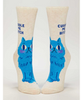 Pair of socks with blue cat design and text on a white background