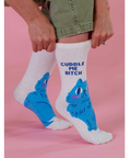 White socks with blue cat design and text on a pink background