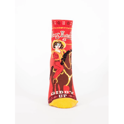 Product page of a red sock with a cowgirl design on a white background