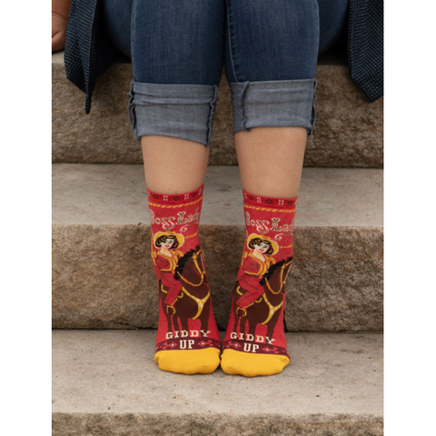 Red and yellow patterned socks with text on a product page