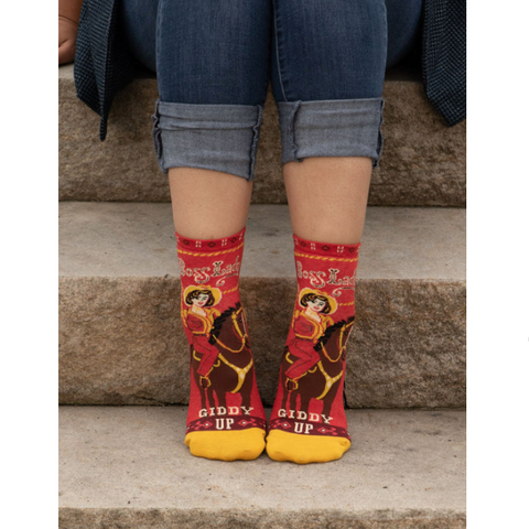 Red and yellow patterned socks with text on a product page