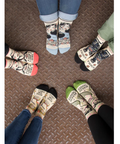 Pair of feet wearing themed socks on a website product page.