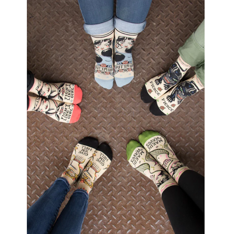 Pair of feet wearing themed socks on a website product page.