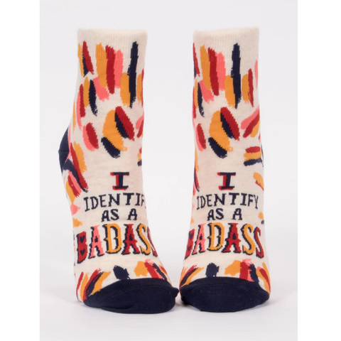 Colorful socks with 'I Identify as a Badass' text on a product page.