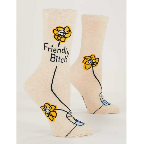 Beige socks with 'Friendly Bitch' text and floral designs on a product page.