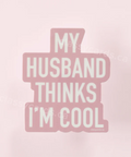 Pink sticker with text 'My Husband Thinks I'm Cool' on a pink background