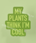 Green card with text 'My plants think I'm cool' on a light green background