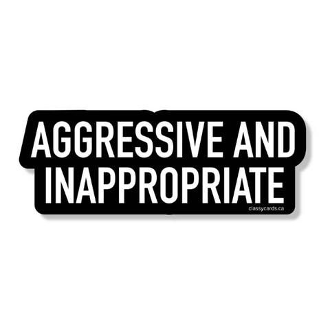 Black rectangular sign with white text 'AGGRESSIVE AND INAPPROPRIATE' on a white background