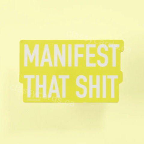 Yellow product with 'MANIFEST THAT SHIT' text on a white background
